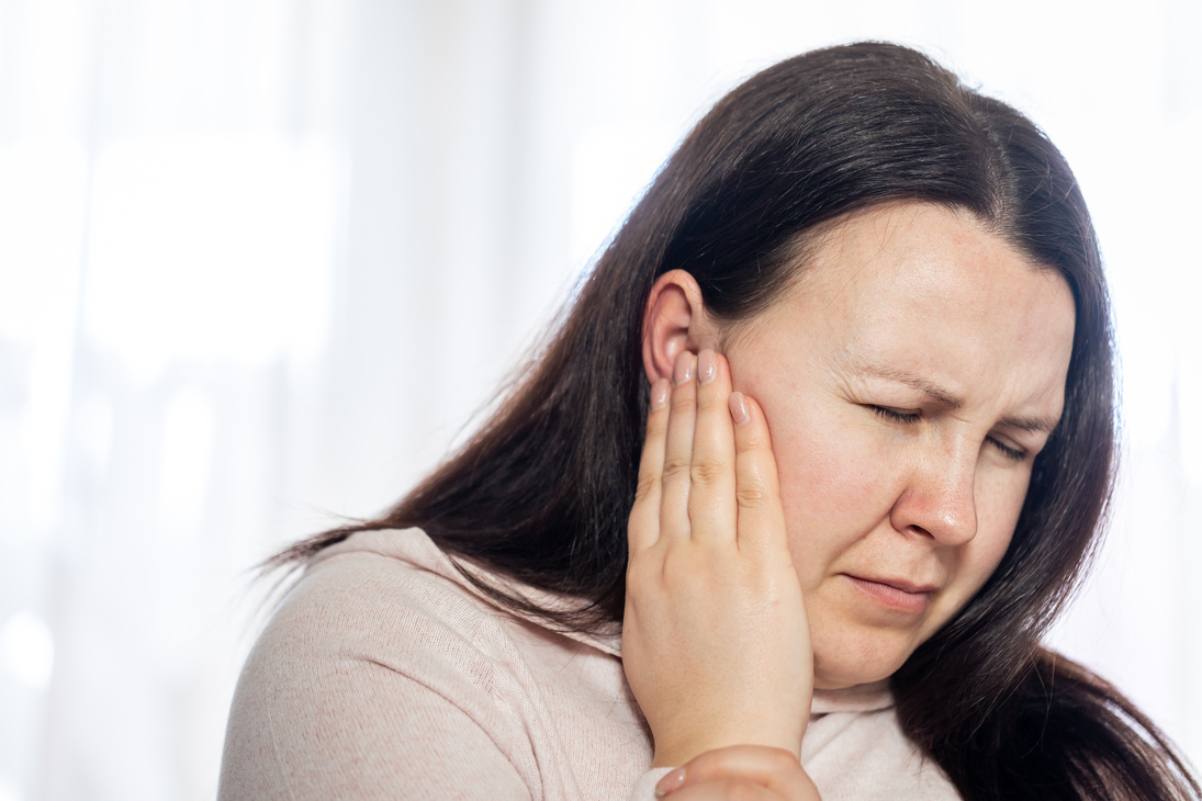 Young Woman Have Headache Migraine Stress or Tinnitus - Noise Wh